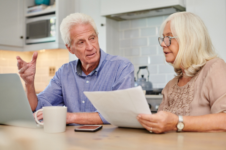 A senior couple discussing their tax plan.
